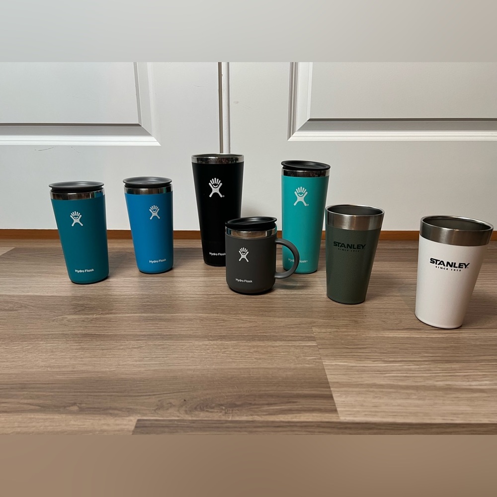 bundle of Hydroflask and Stanley tumblers